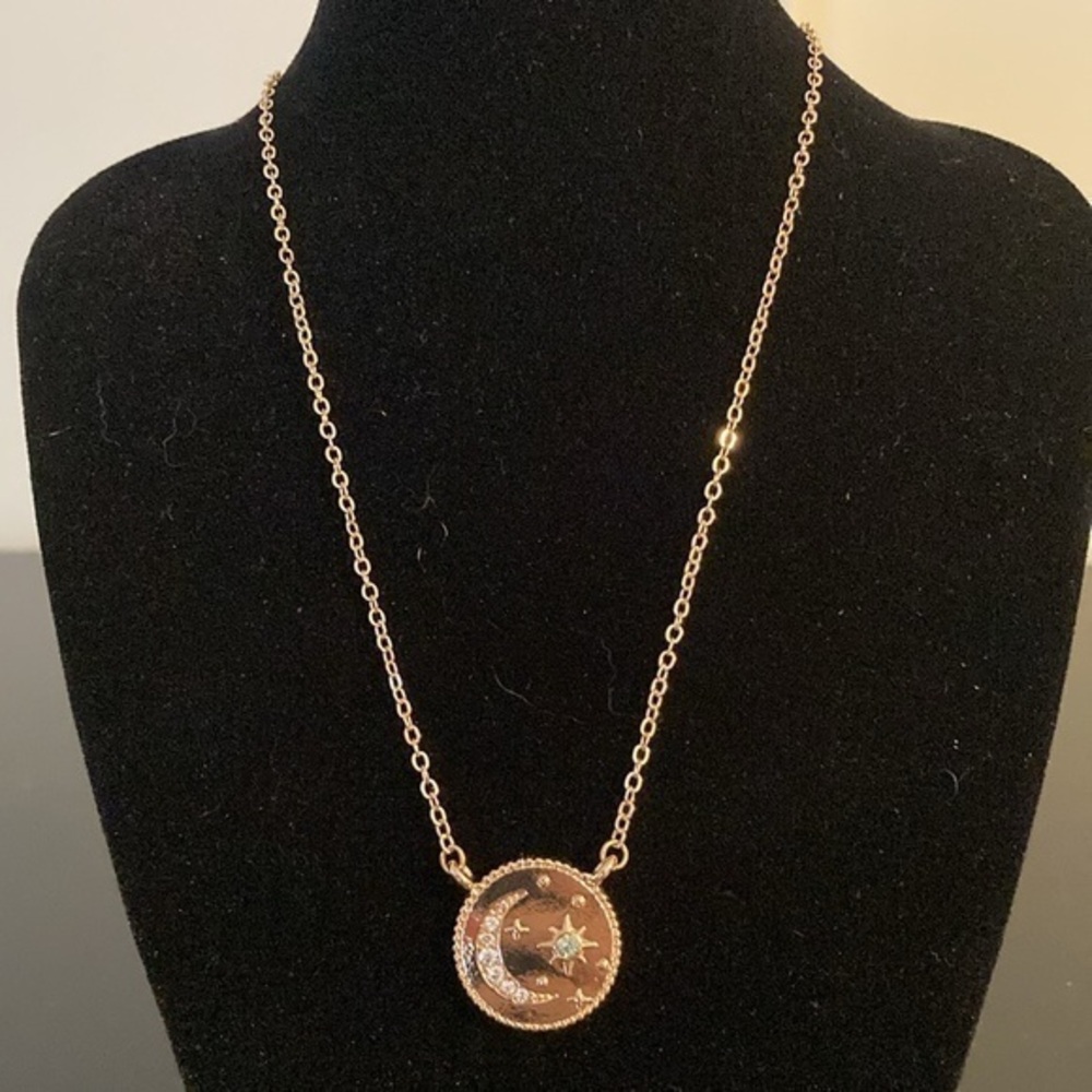 Uncas International Vendor Samples pendant  necklace in golden tones.
